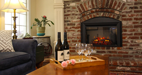 fireplace with wine and glasses
