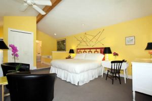 room with bed and chairs - sonoma county hotel lodging