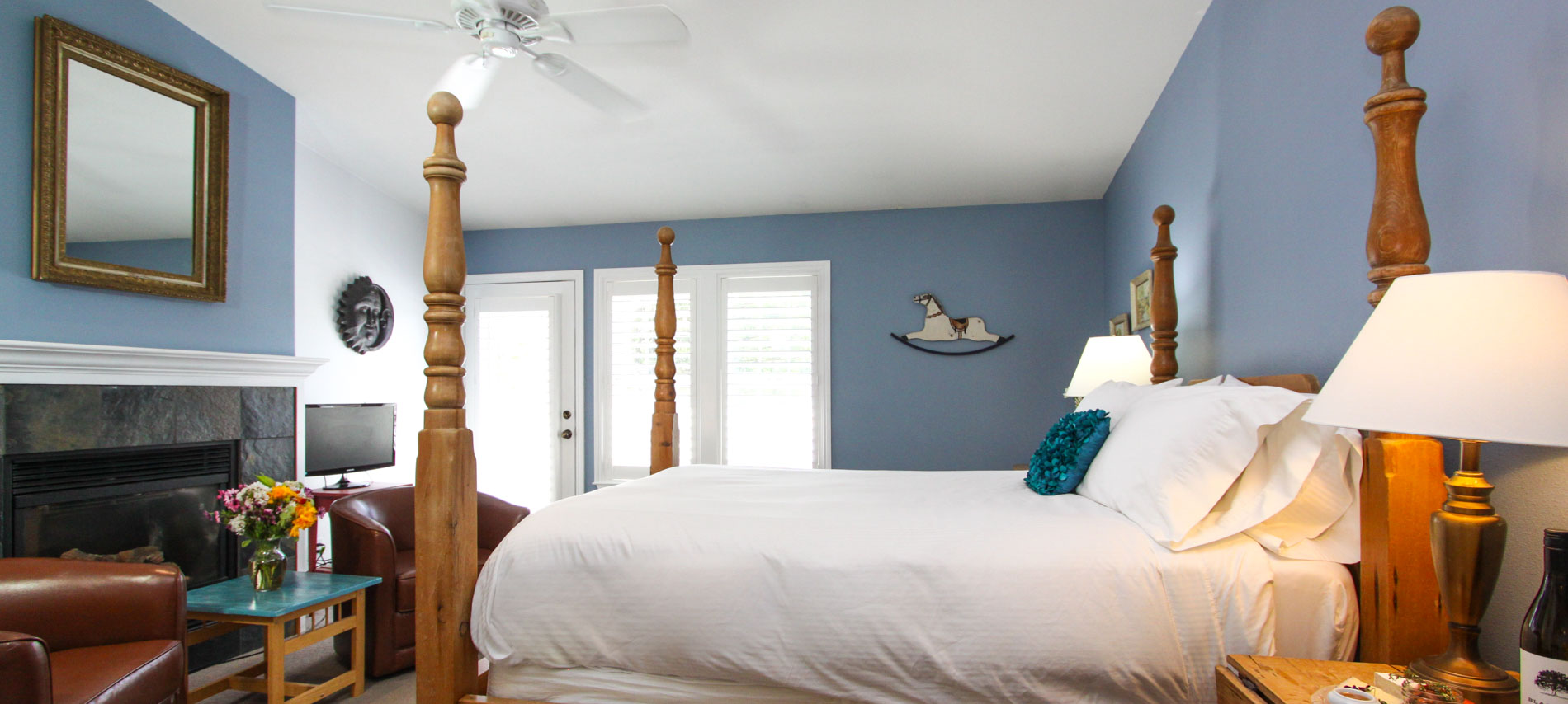 folk art bed, fireplace, chairs and spa tub